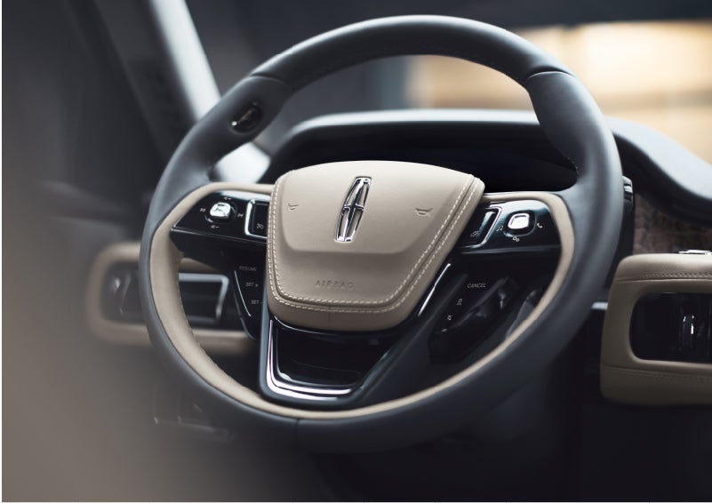 The intuitively placed controls of the steering wheel on a 2023 Lincoln Aviator® SUV | Angela Krause Lincoln of Alpharetta in Alpharetta GA