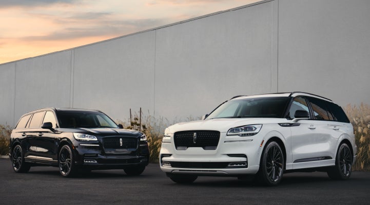 Two Lincoln Aviator® SUVs are shown with the available Jet Appearance Package | Angela Krause Lincoln of Alpharetta in Alpharetta GA
