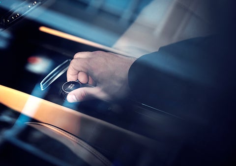 The driver of a 2023 Lincoln Corsair® SUV is shown adjusting the drive mode. | Angela Krause Lincoln of Alpharetta in Alpharetta GA