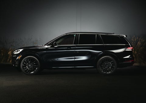 A 2024 Lincoln Aviator® SUV is shown in the Infinite Black exterior color | Angela Krause Lincoln of Alpharetta in Alpharetta GA