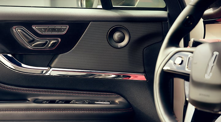 A Revel® audio speaker is shown in the driver’s side door of a 2024 Lincoln Corsair® SUV. | Angela Krause Lincoln of Alpharetta in Alpharetta GA