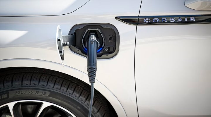 An electric charger is shown plugged into the charging port of a Lincoln Corsair® Grand Touring
model. | Angela Krause Lincoln of Alpharetta in Alpharetta GA