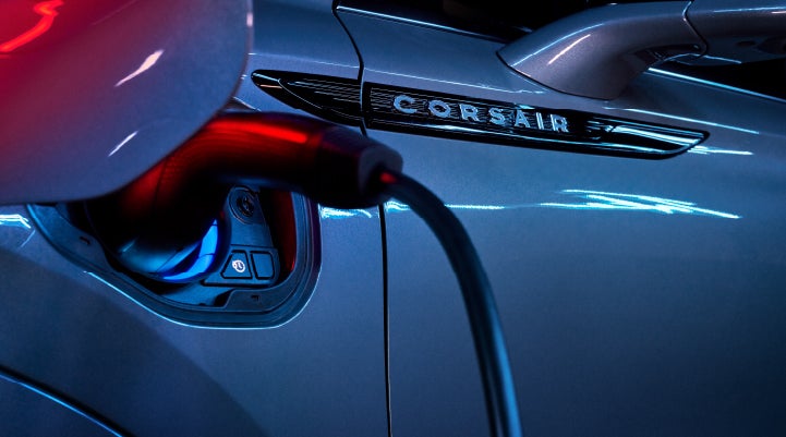 A charger plugged into the charging port of a 2024 Lincoln Corsair® Plug-in Hybrid model. | Angela Krause Lincoln of Alpharetta in Alpharetta GA