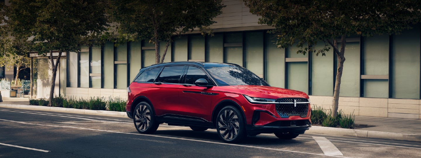 A 2025 Lincoln Nautilus® SUV with an available hybrid powertrain is parked in an urban setting. | Angela Krause Lincoln of Alpharetta in Alpharetta GA