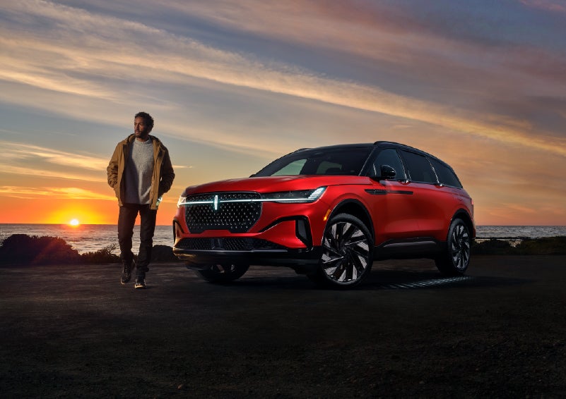A person is shown next to a 2025 Lincoln Nautilus® SUV as the Lincoln Embrace sequence takes place. | Angela Krause Lincoln of Alpharetta in Alpharetta GA