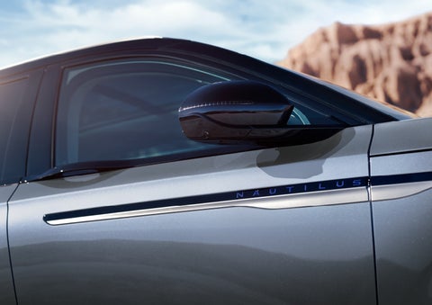 Blue lettering on the side of the vehicle that reads nautilus indicates the available hybrid powertrain. | Angela Krause Lincoln of Alpharetta in Alpharetta GA