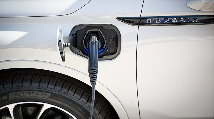 An electric charger is shown plugged into the charging port of a Lincoln Corsair® Grand Touring
model. | Angela Krause Lincoln of Alpharetta in Alpharetta GA