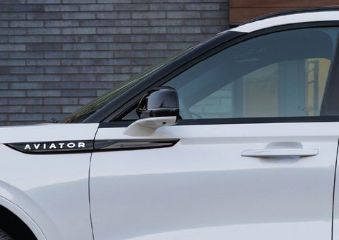 The driver’s side door and fender badging of a white 2026 Lincoln Aviator® SUV are showcased. | Angela Krause Lincoln of Alpharetta in Alpharetta GA