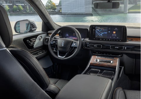 The interior of the 2026 Lincoln Aviator® SUV is shown parked with a view of a harbor through the windshield. | Angela Krause Lincoln of Alpharetta in Alpharetta GA