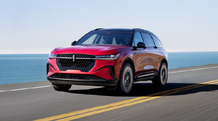 A 2026 Lincoln Nautilus® SUV is being driven on a seaside roadway. | Angela Krause Lincoln of Alpharetta in Alpharetta GA