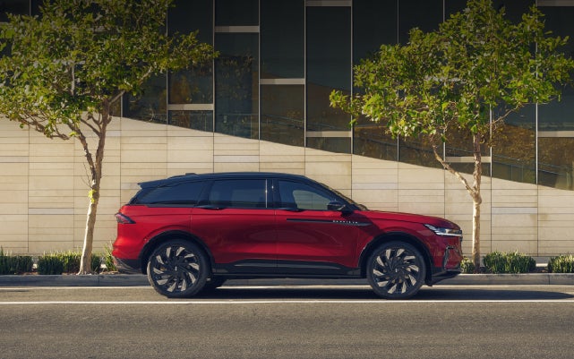 A 2026 Lincoln Nautilus® SUV with an available Hybrid Powertrain is parked in an urban setting. | Angela Krause Lincoln of Alpharetta in Alpharetta GA