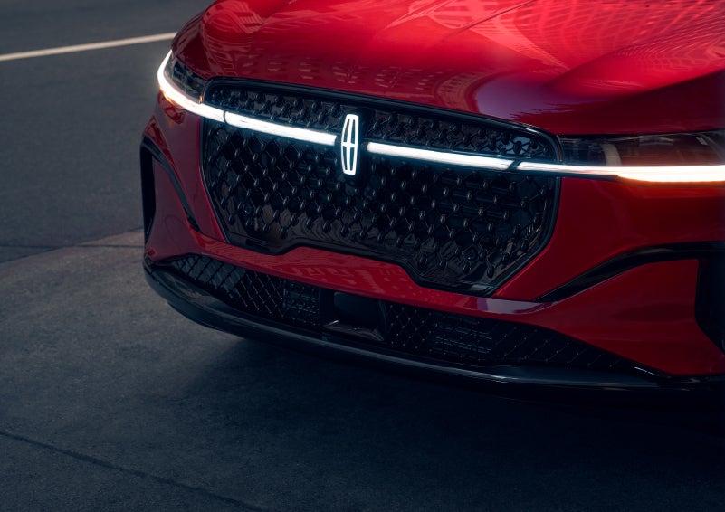The available front LED light bar and center Lincoln Star logo glow at dusk. | Angela Krause Lincoln of Alpharetta in Alpharetta GA